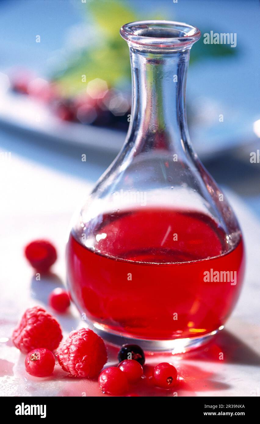 Homemade red berry vinegar in a glass bottle Stock Photo Alamy
