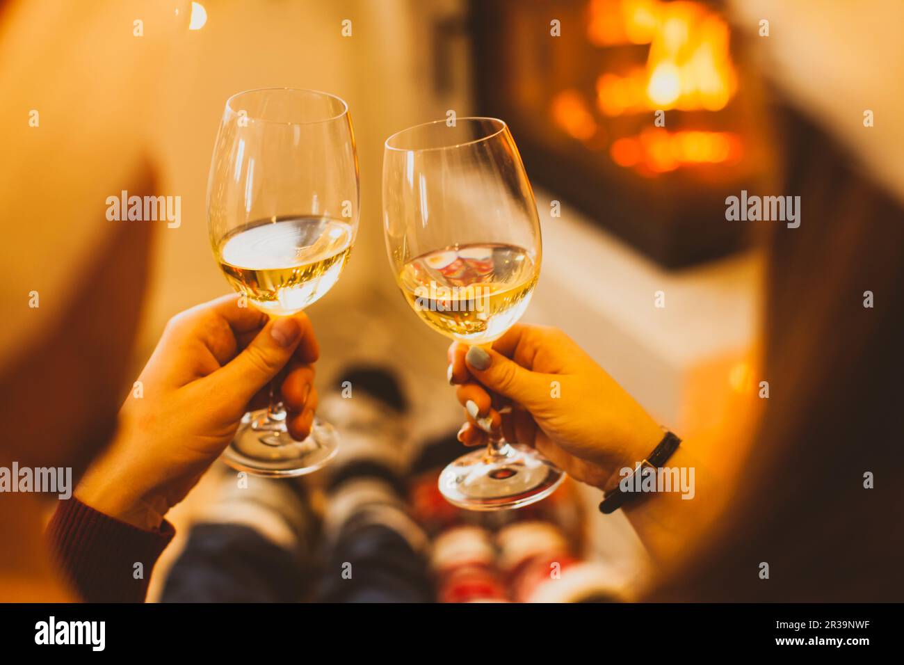 Two glasses of wine in man's and woman's hands Stock Photo