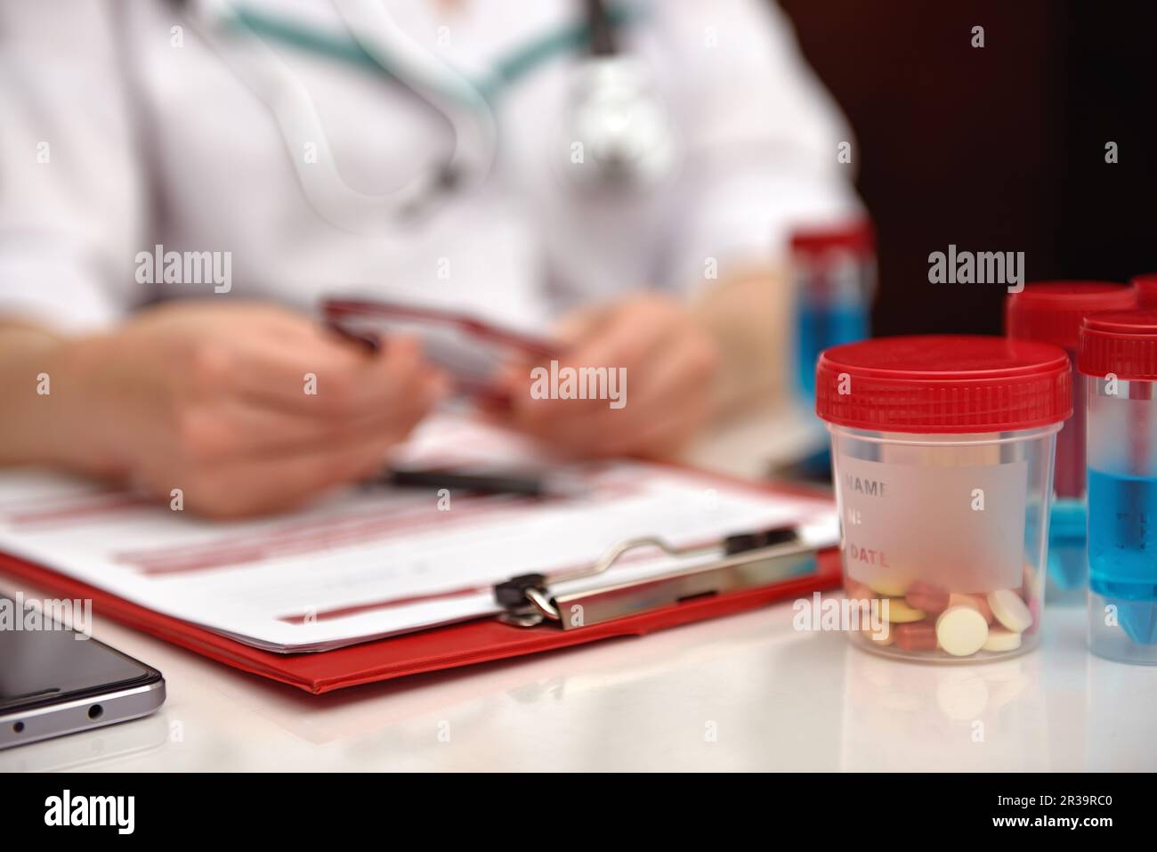 Woman Therapist Sitting In Clinic And Holding Glasses In Hand Stock Photo