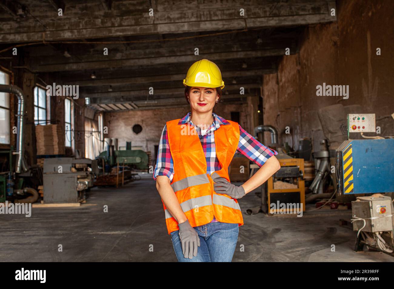 Young woman worker of furniture plant, indoors Stock Photo