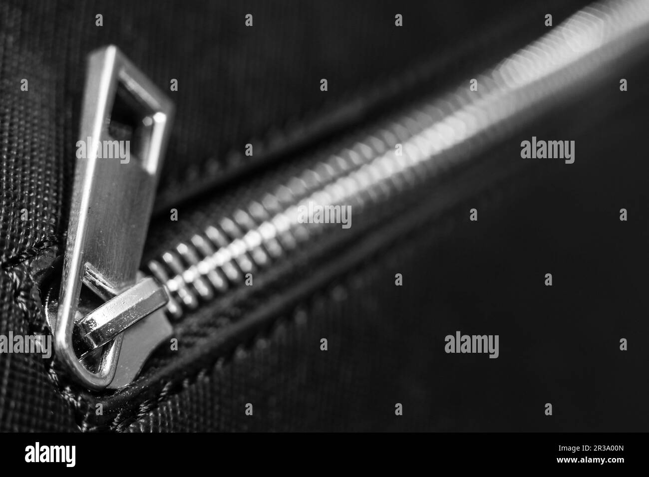 Zip fastener on black handbag Stock Photo