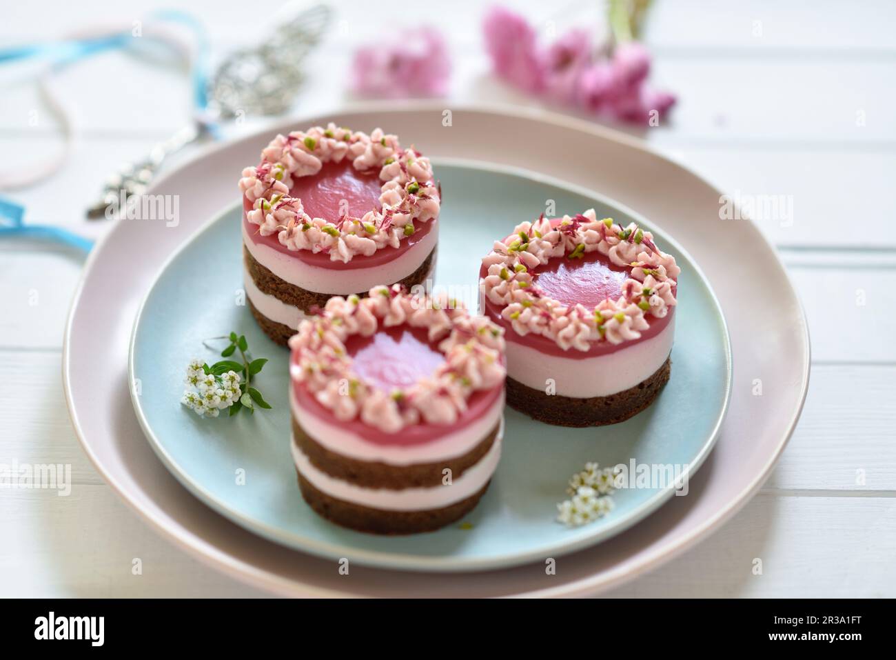 Vegan pink dragon fruit cream cheese tarts with chocolate biscuit bases