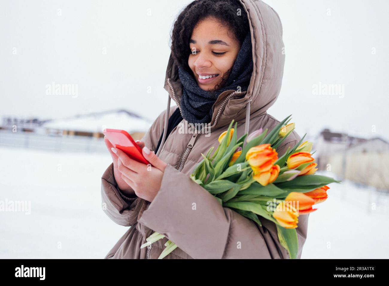 Premium Photo  Happy beautiful young african girl with a smile in  fashionable warm winter clothes walks outdoors with snow