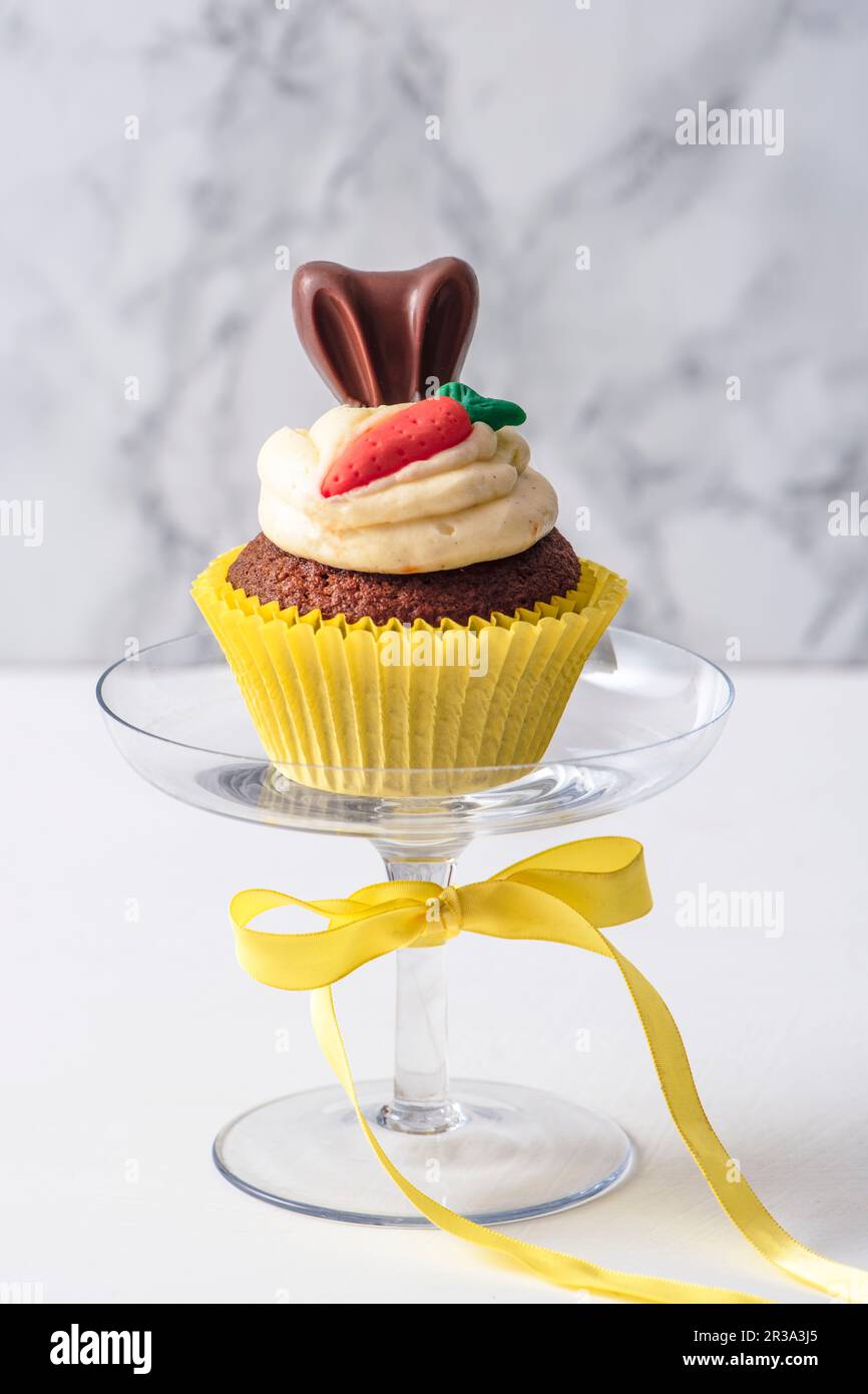Carrot cupcake on a cake stand Stock Photo