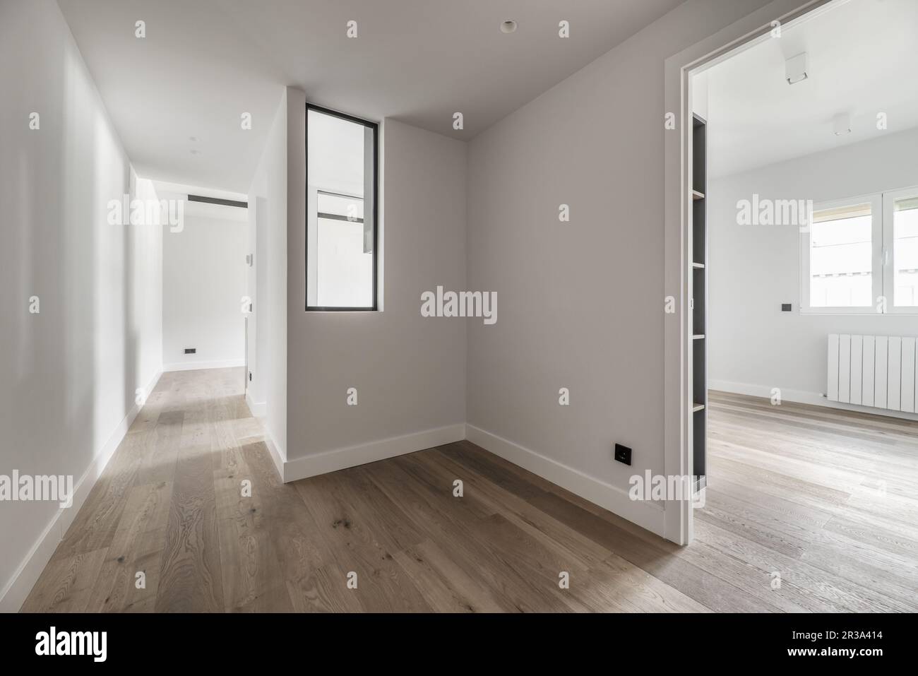 Distributor of recently renovated house with skylight and wooden floors and access to other rooms Stock Photo