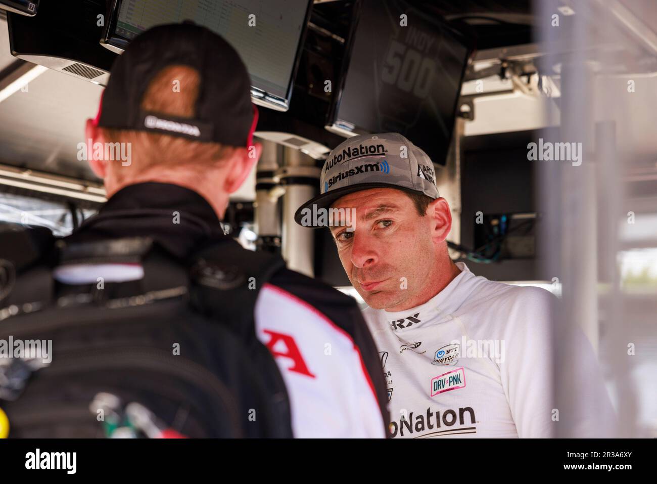 Indianapolis, United States. 22nd May, 2023. Meyer Shank Racing driver Hélio Castroneves (06) of Brazil talks to crew members during practice for the Indy 500 at Indianapolis Motor Speedway in Indianapolis. Credit: SOPA Images Limited/Alamy Live News Stock Photo
