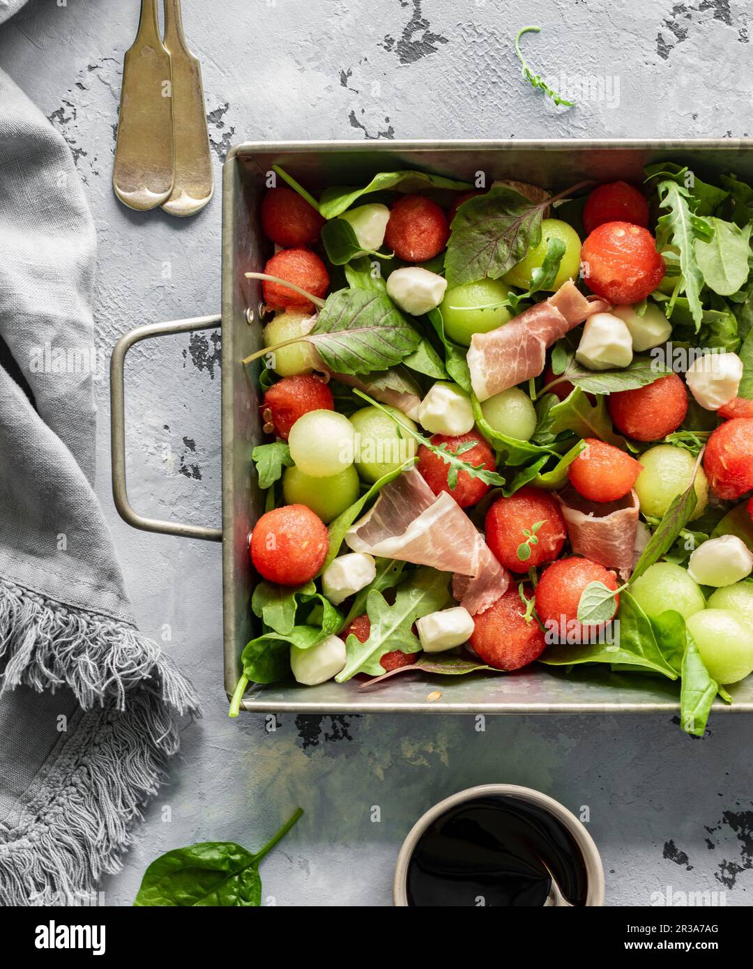 Melon and prosciutto salad Stock Photo