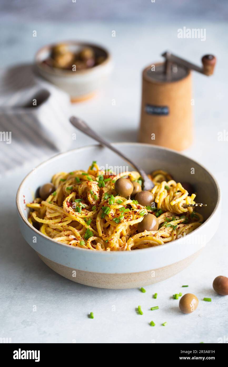 Spaghetti with Fresh Tomato Sauce, green olives and chives. Italian