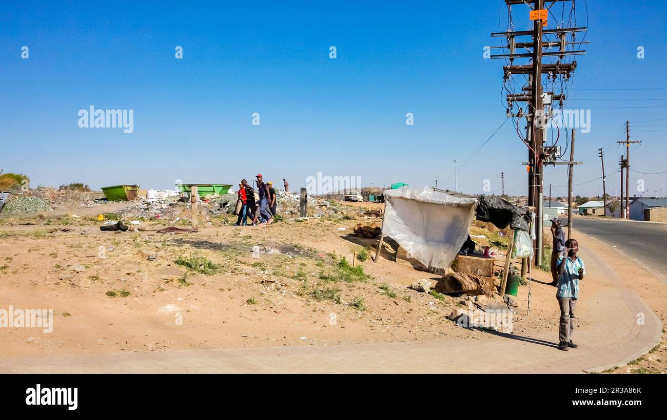 Small informal hawker selling items on street in urban Soweto South Africa Stock Photo