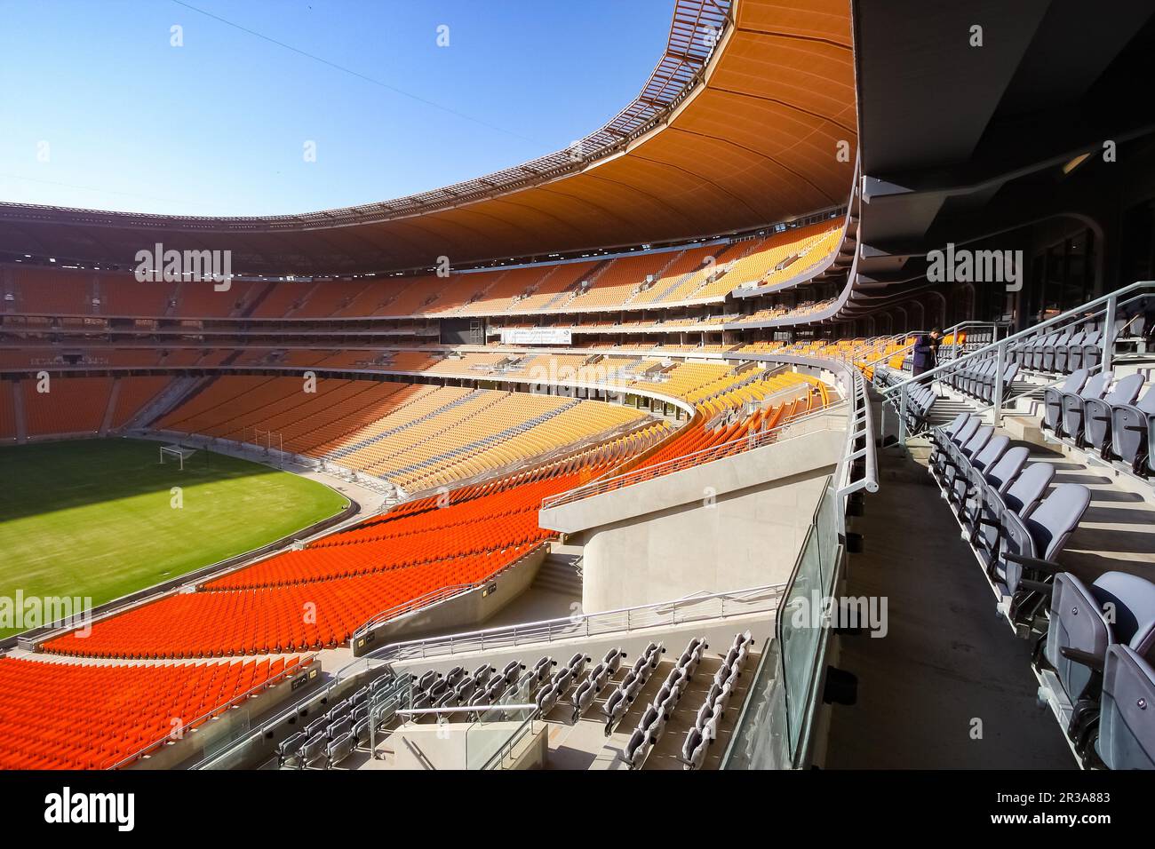 Empty Soccer Football stadium with orange seating Stock Photo