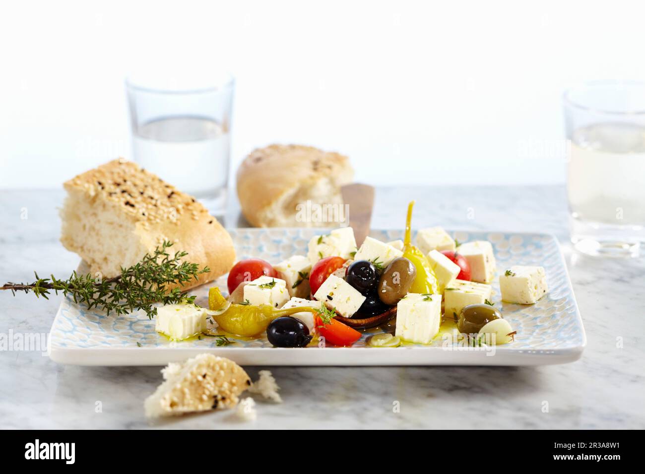 Feta cheese preserved in olive oil with tomatoes, garlic, jalapenos and