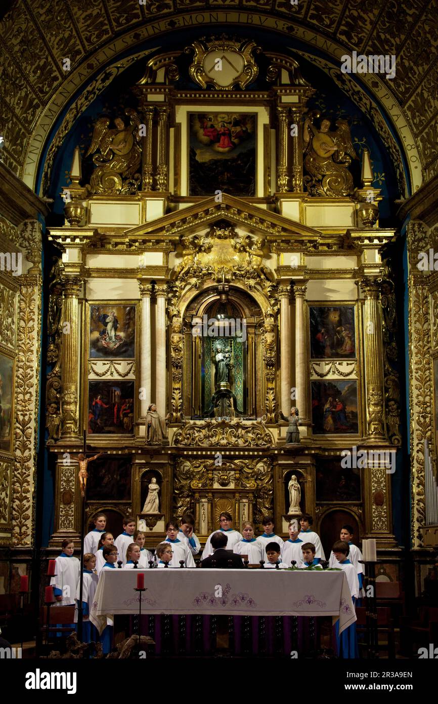 SPAIN Balearic Islands, Mallorca.Santuario de Lluc, Escorca.Actuacion de ' Es blauets de Lluc' en la Basilica frente al retablo mayor , obra del Maestro Jaume Blanquer, con la imagen de Santa María, colocada en el centro en un nicho rotatorio. Stock Photo