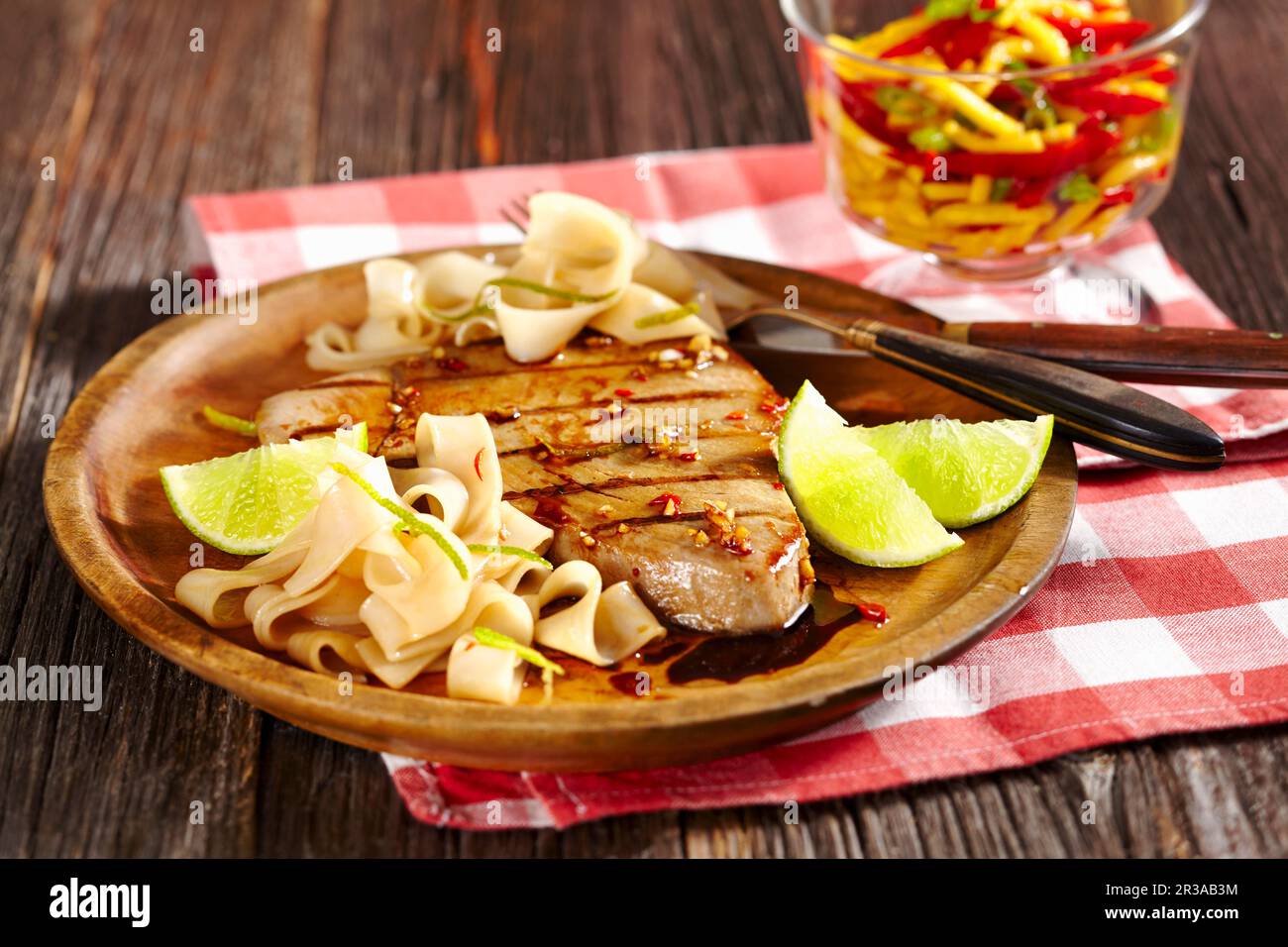 Grilled marinated tuna fish with tagliatelle and lime Stock Photo Alamy