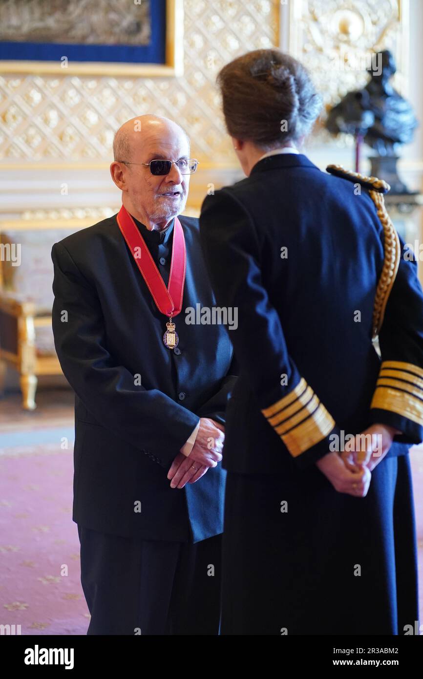 Sir Salman Rushdie is made a Companion of Honour by the Princess Royal at Windsor Castle. The honour recognises services to literature. Picture date: Tuesday May 23, 2023. Stock Photo