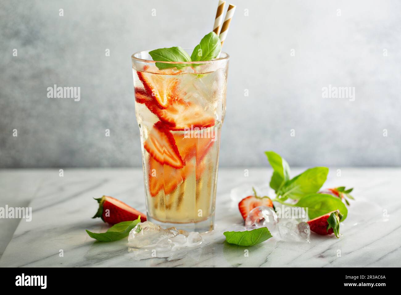 Iced green tea with strawberries and basil Stock Photo
