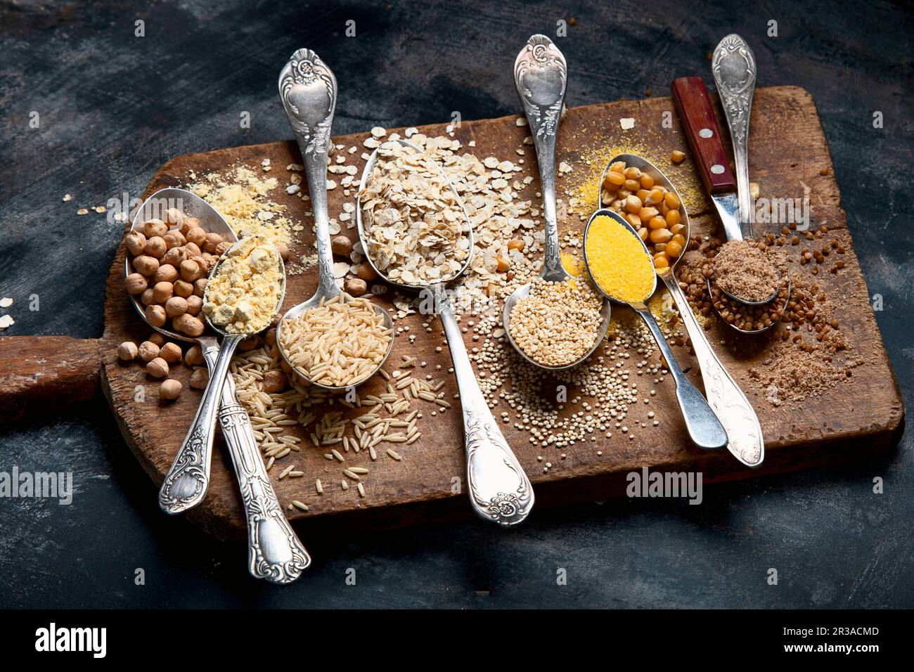 Healthy gluten free grains and flours on rustic wooden board Stock