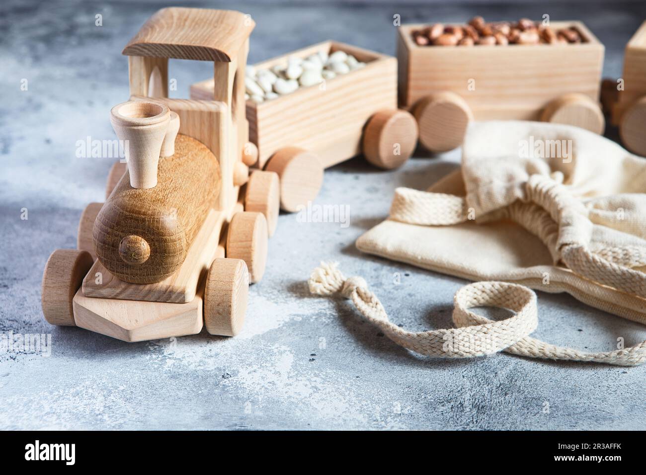 Children's wooden toys. Children wooden train with wagons. Natural wood