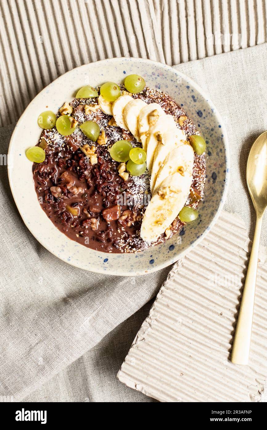 Rice porridge with chia seeds and fruits Stock Photo Alamy