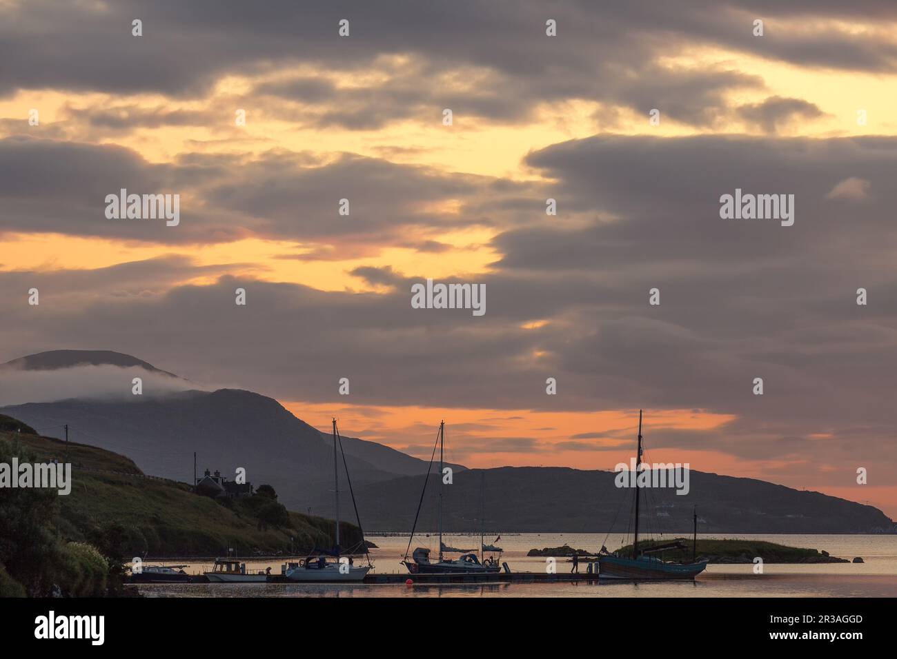 Illuminated Sky in the late Evening Light, North Harbour, Scalpay of Harris, Hebrides, Outer Hebrides, Western Isles, Scotland, United Kingdom Stock Photo