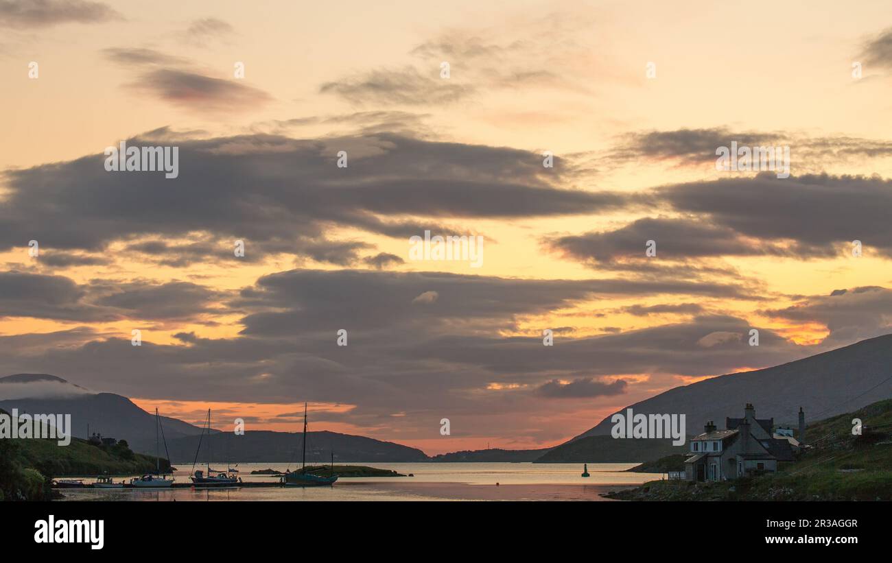 Sunset over North Harbour, Scalpay of Harris, Hebrides, Outer Hebrides, Western Isles, Scotland, United Kingdom, Great Britain Stock Photo