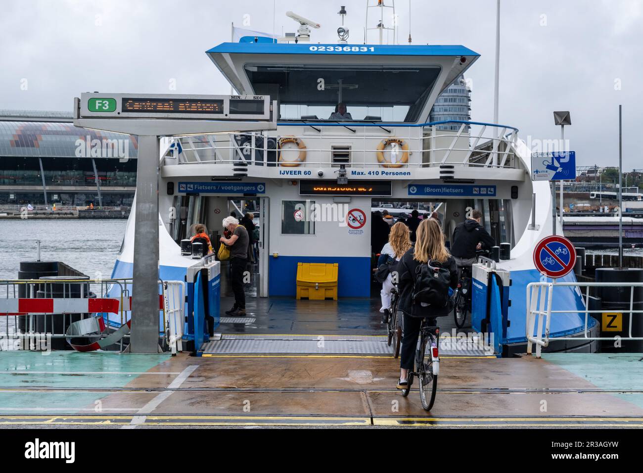 Amsterdam, The Netherlands - 8 September 2022: People going into a GVB ferryboat Stock Photo
