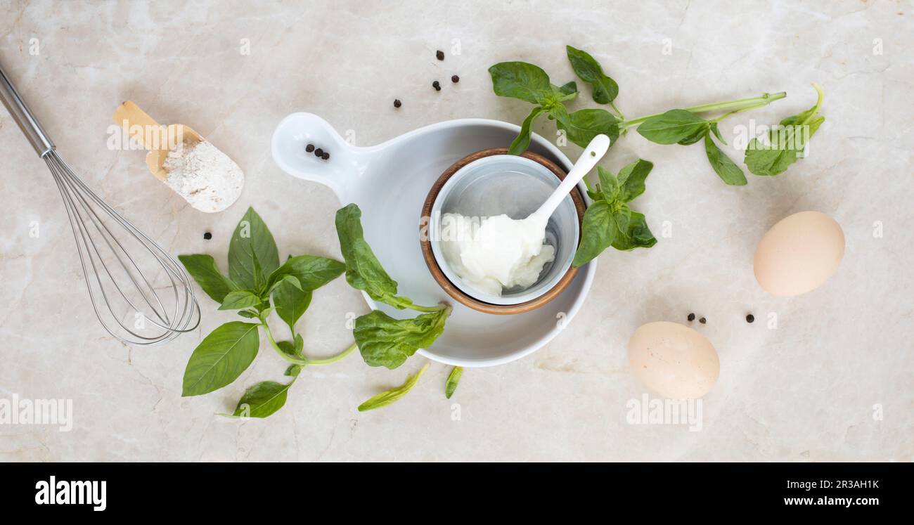 Ricotta, basil, eggs and flour Stock Photo