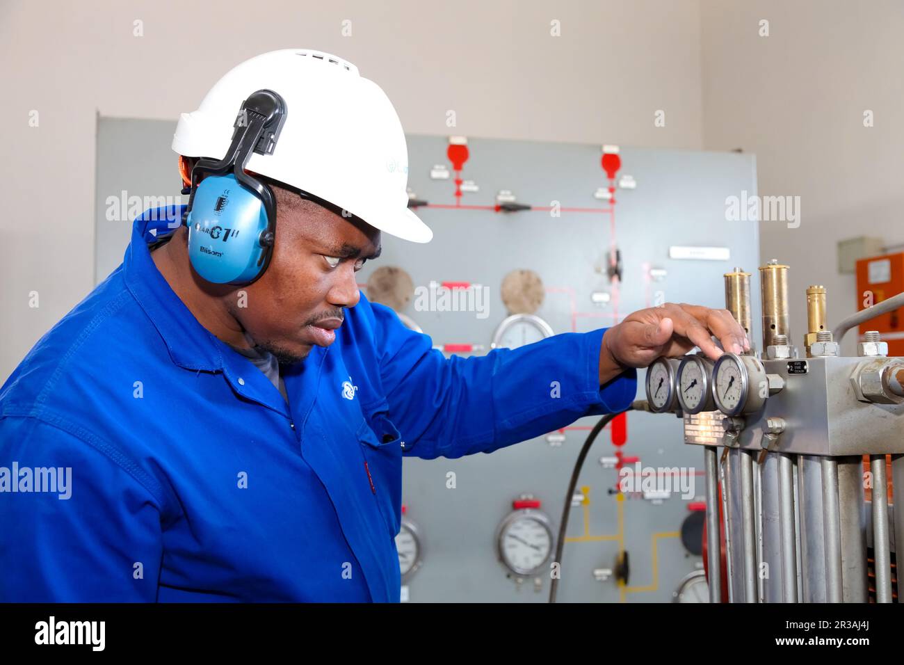 Electrical Engineer checking gauge equipment Stock Photo Alamy