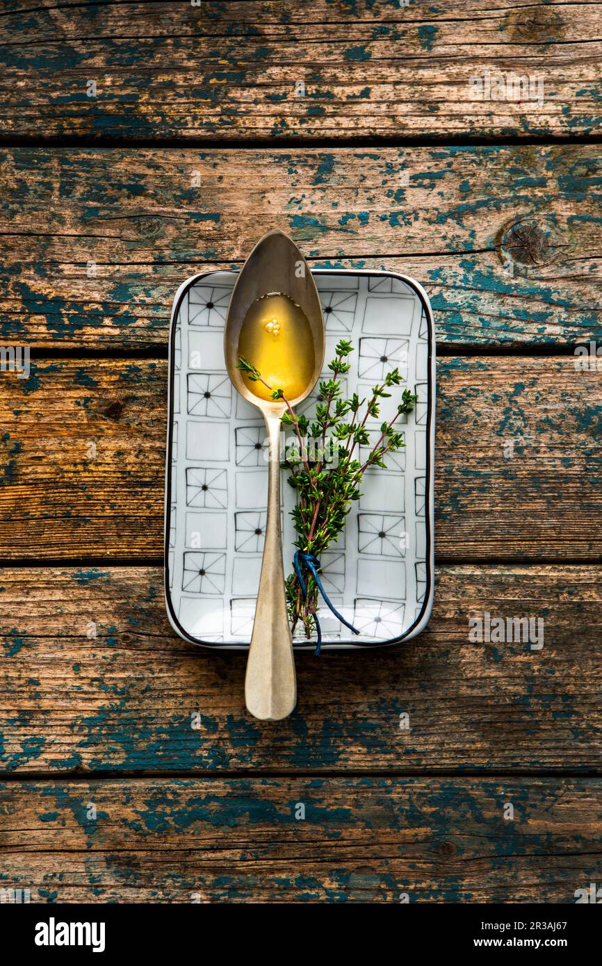 Homemade cough syrup with thyme and honey Stock Photo Alamy