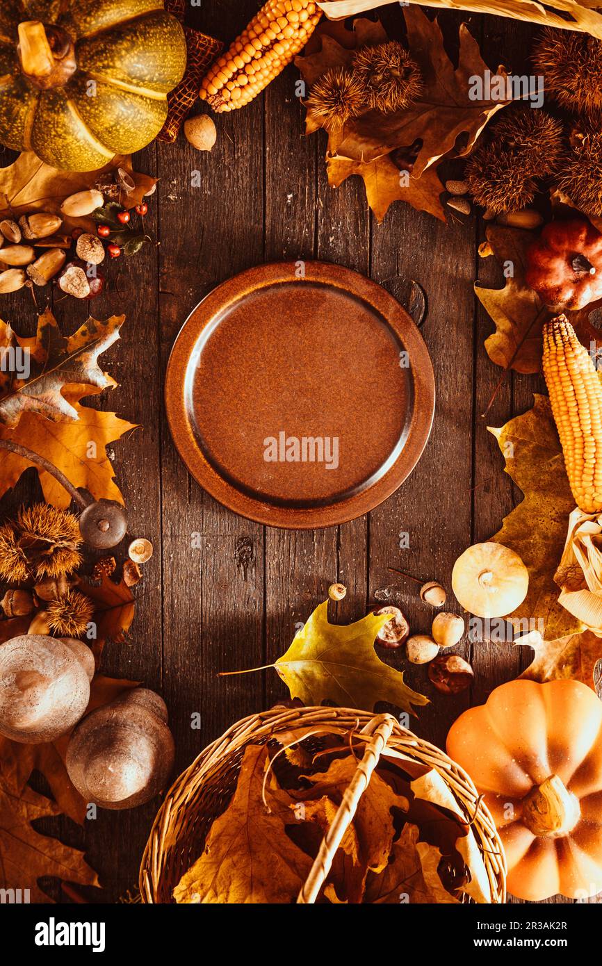 Thanksgiving dinner, autumn fruit with plate and cutlery Stock Photo