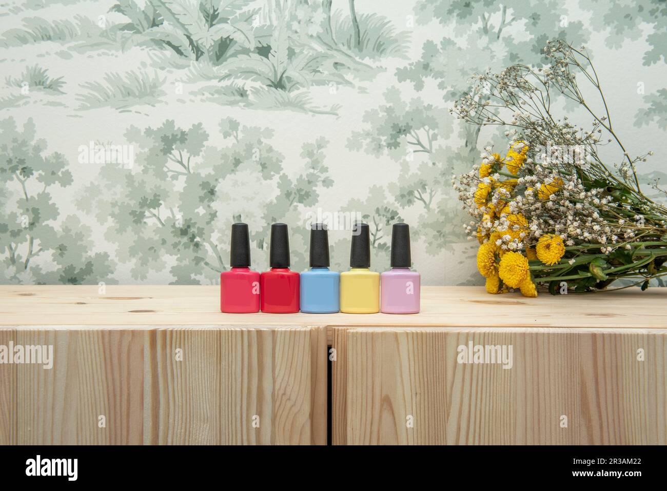 A few small glass containers of nail polish of various colors in a