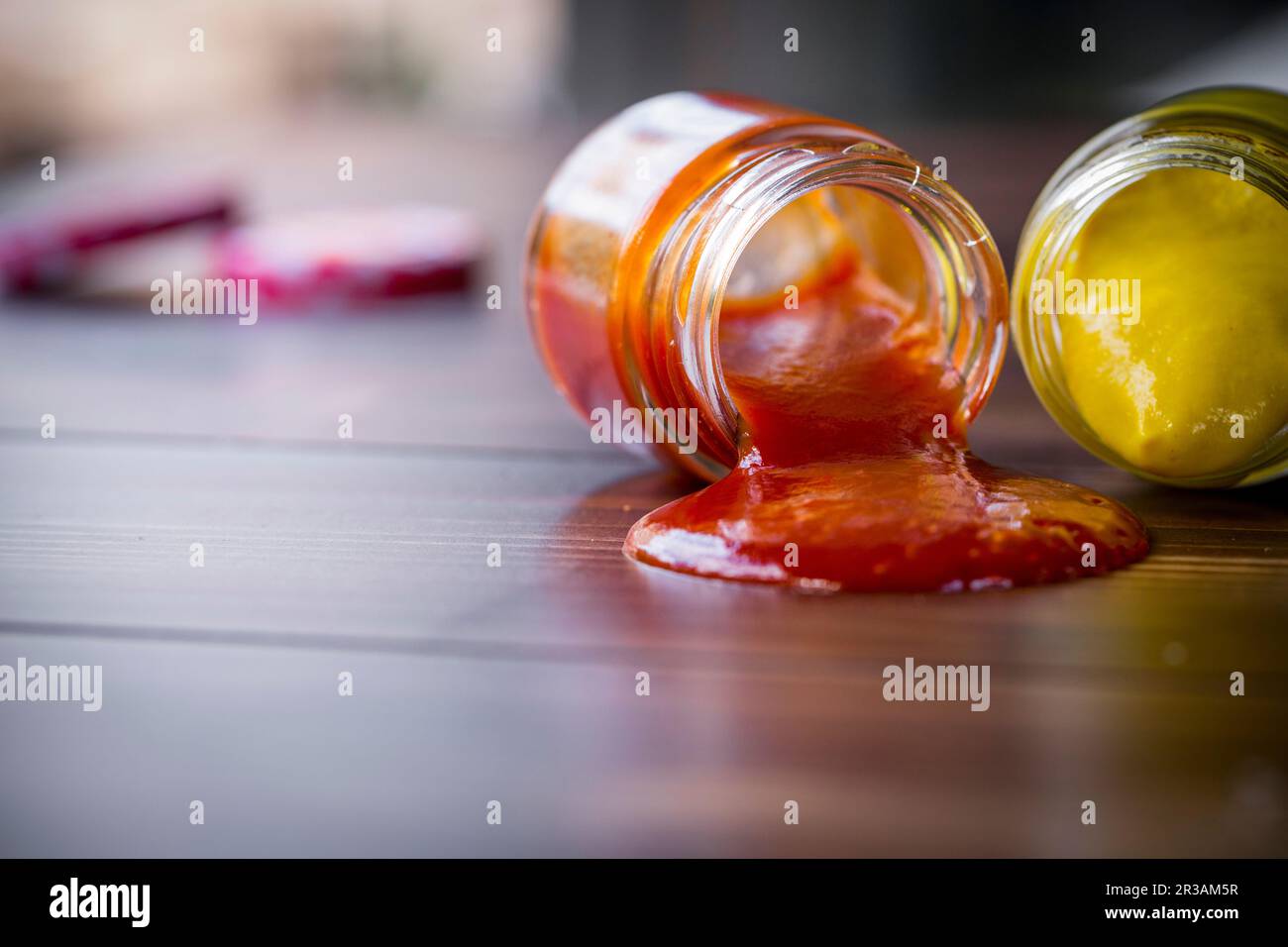 Dropped jars with sauce Stock Photo Alamy