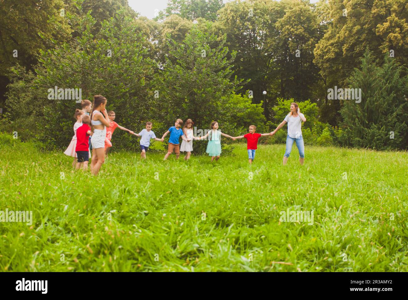 Kids holding hands row happy hi-res stock photography and images - Alamy