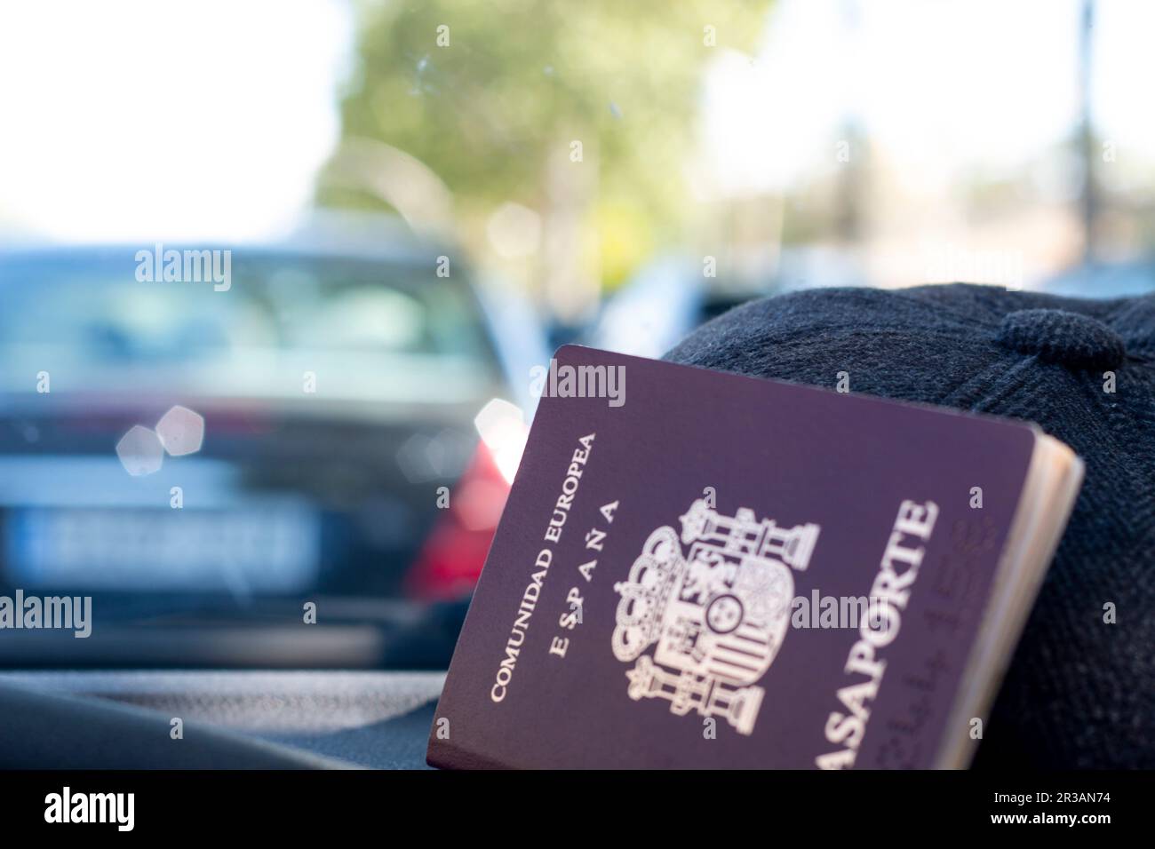Passport of the European community, of Spain. With a background of a map, pride flag, inside a car or with sunglasses, or a hat Stock Photo