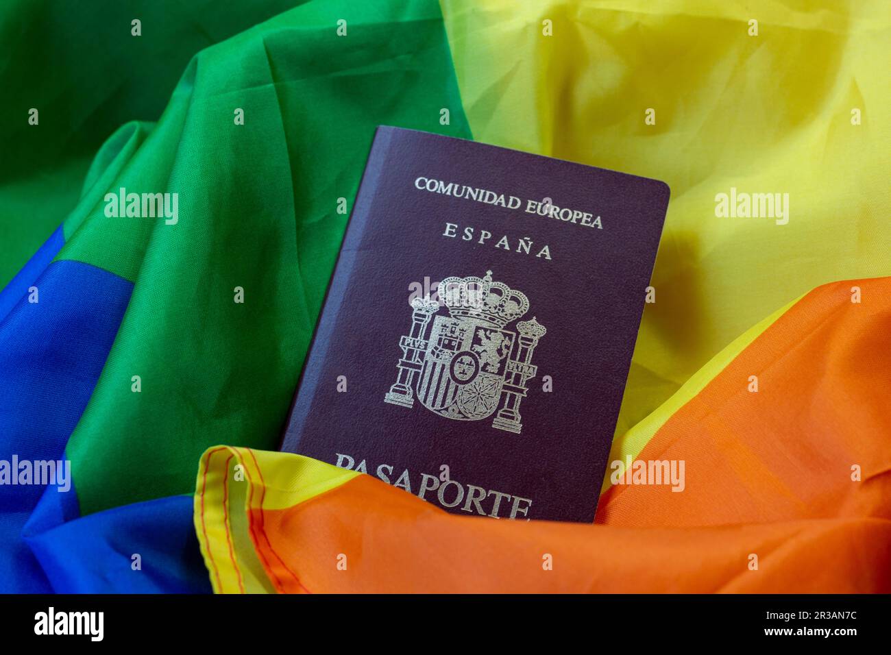 Passport of the European community, of Spain. With a background of a map, pride flag, inside a car or with sunglasses, or a hat Stock Photo
