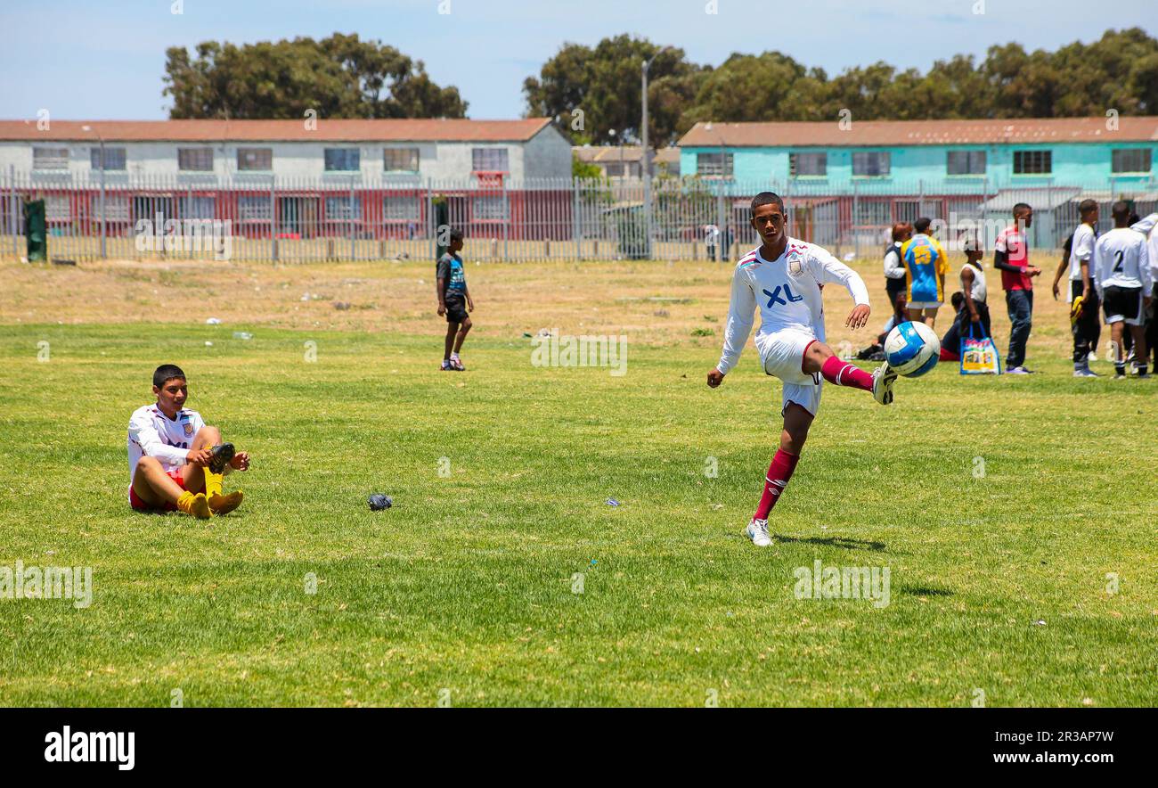 Diverse children playing soccer football at school Stock Photo Alamy