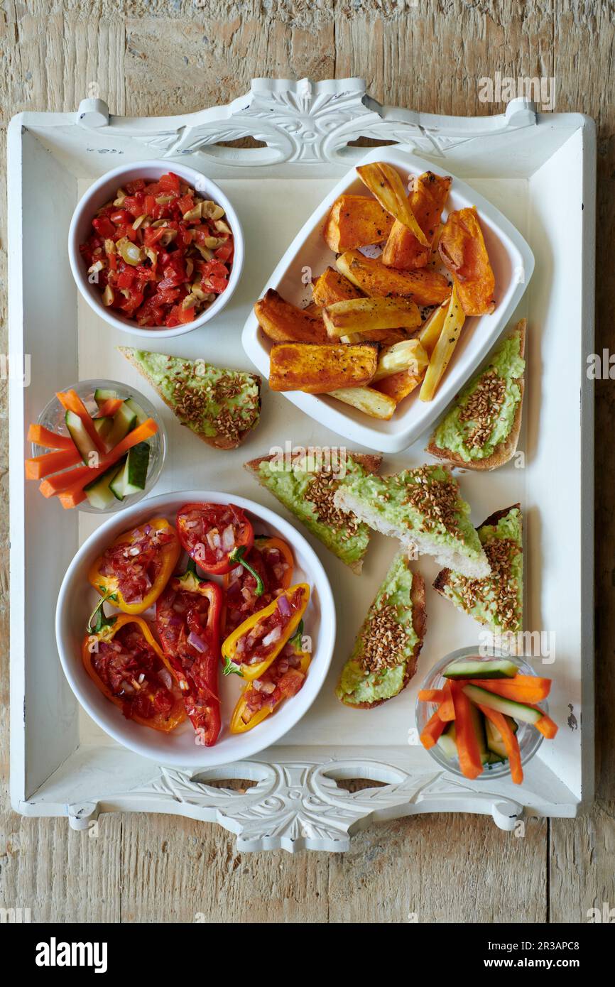 Stuffed Peppers with Avocado Toast and Roasted Sweet Potato Chips Stock Photo