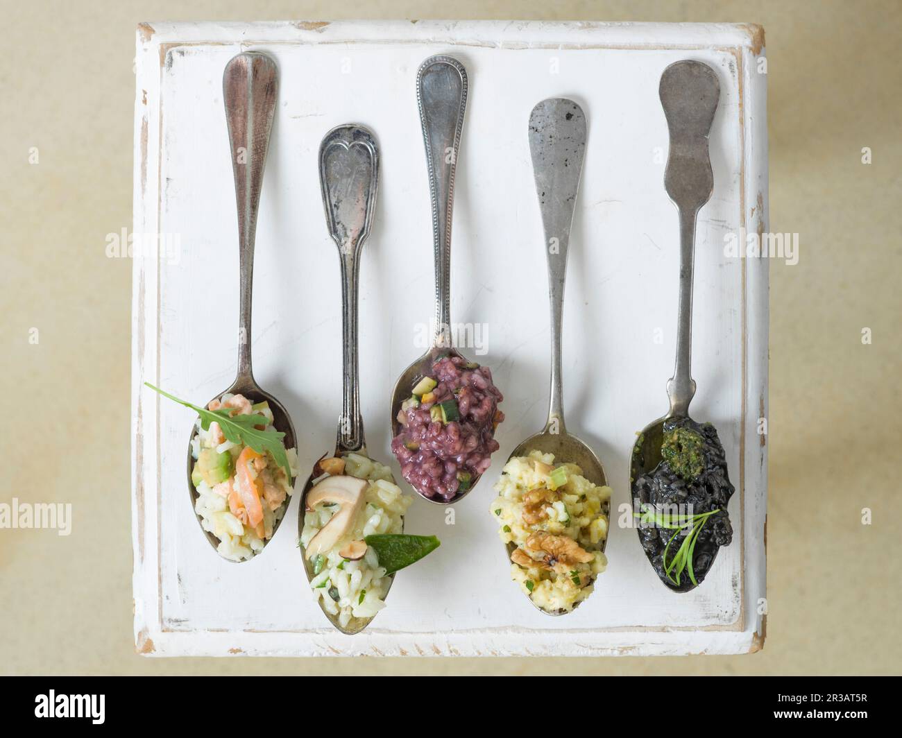 Different Risotto Different types of risotto on spoons Stock Photo - Alamy