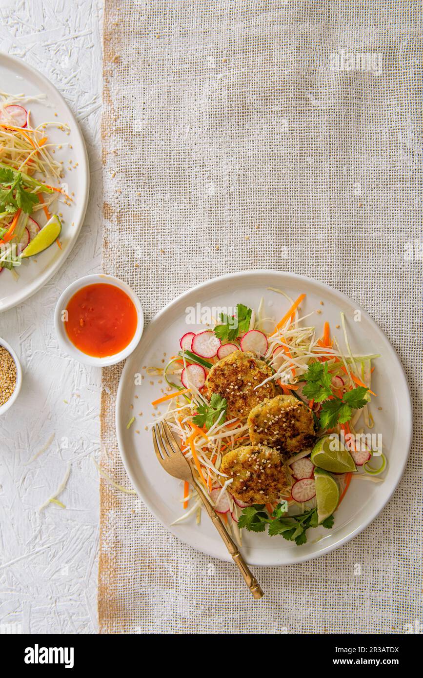 Thai fish cakes with crunchy salad and chilli dipping sauce Stock Photo