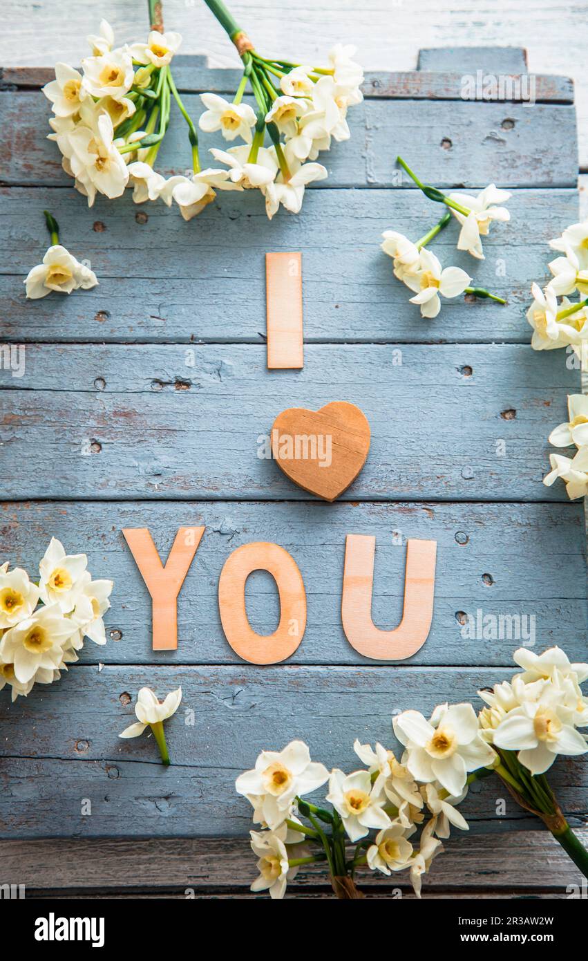 Spring table setting with narcissus flowers Stock Photo