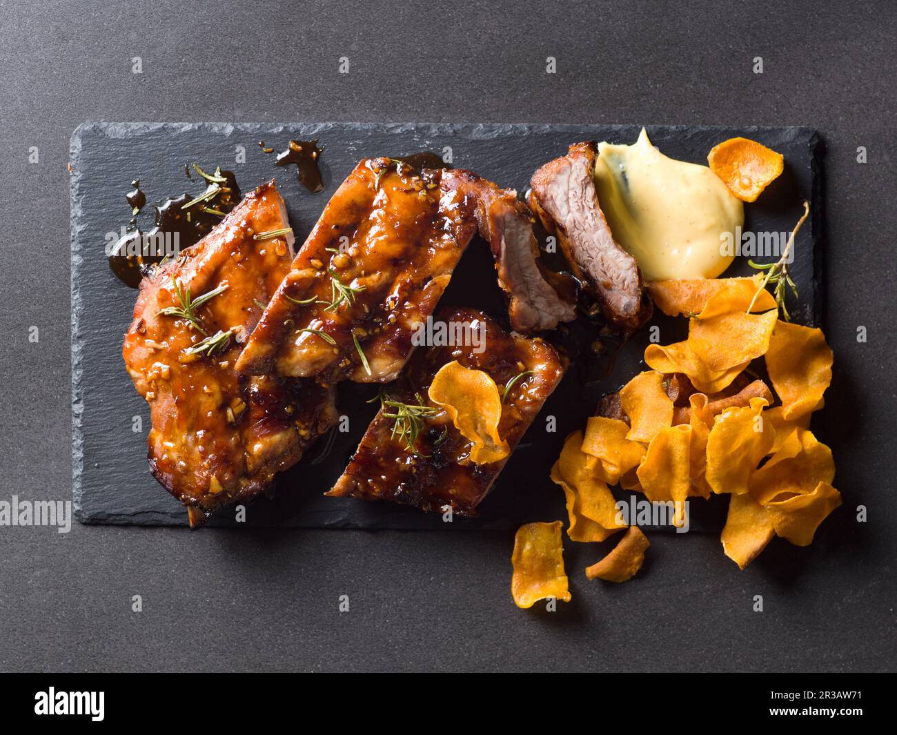 Spare ribs with mustard and crisps Stock Photo Alamy