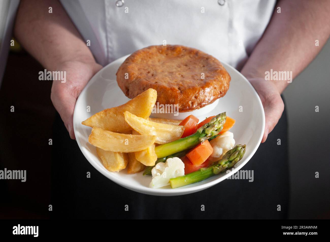 Pie with vegetables and potato wedges Stock Photo