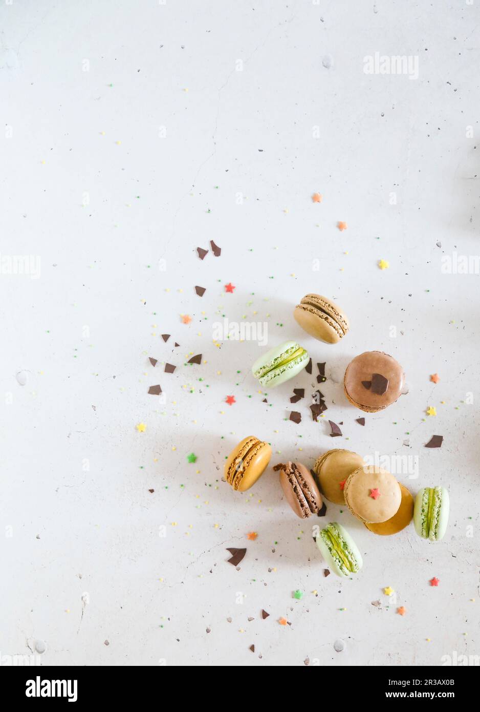 Colorful macarones with chocolate chips and sugar stars Stock Photo