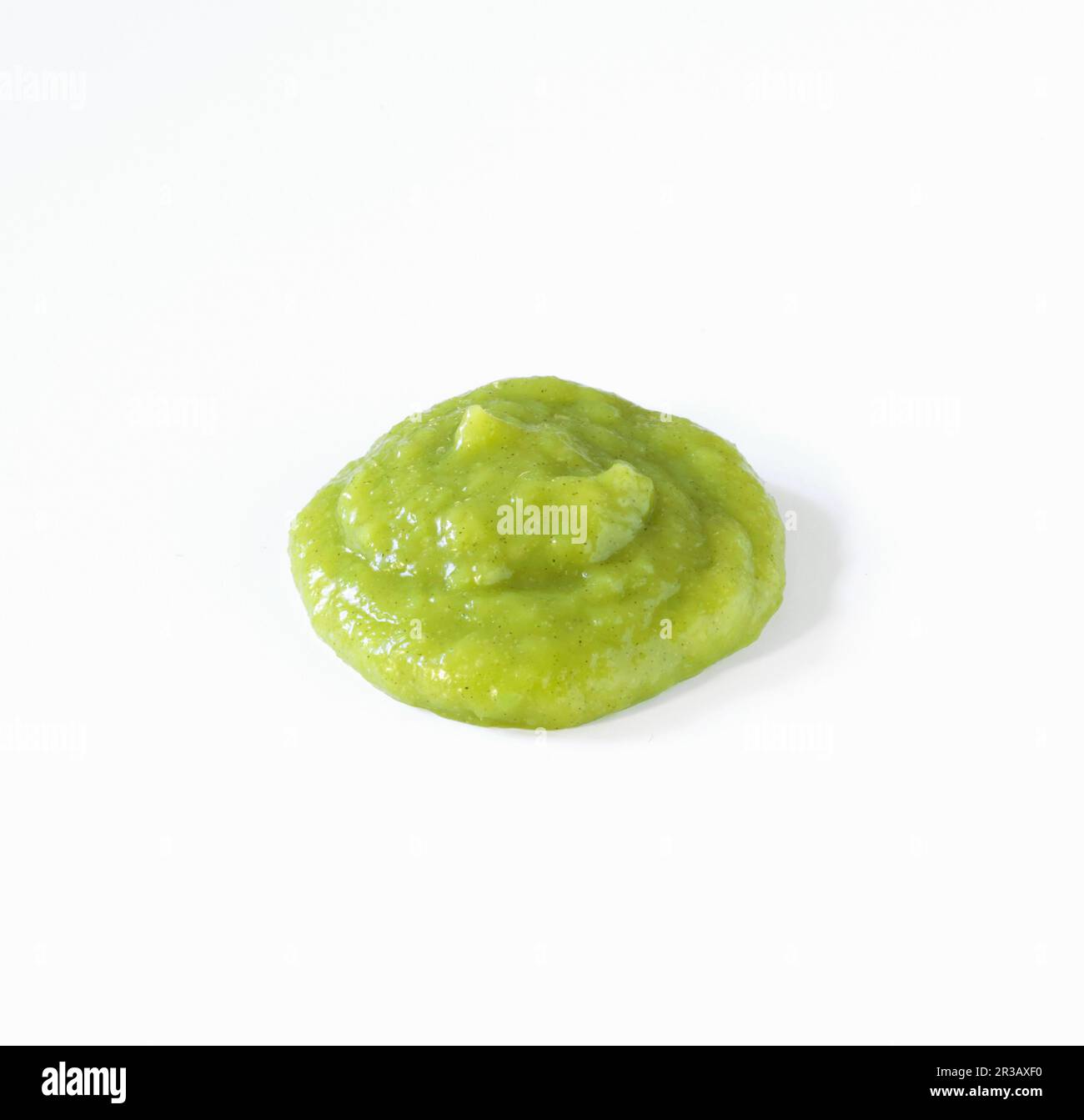 A dollop of wasabi sauce on a white background Stock Photo