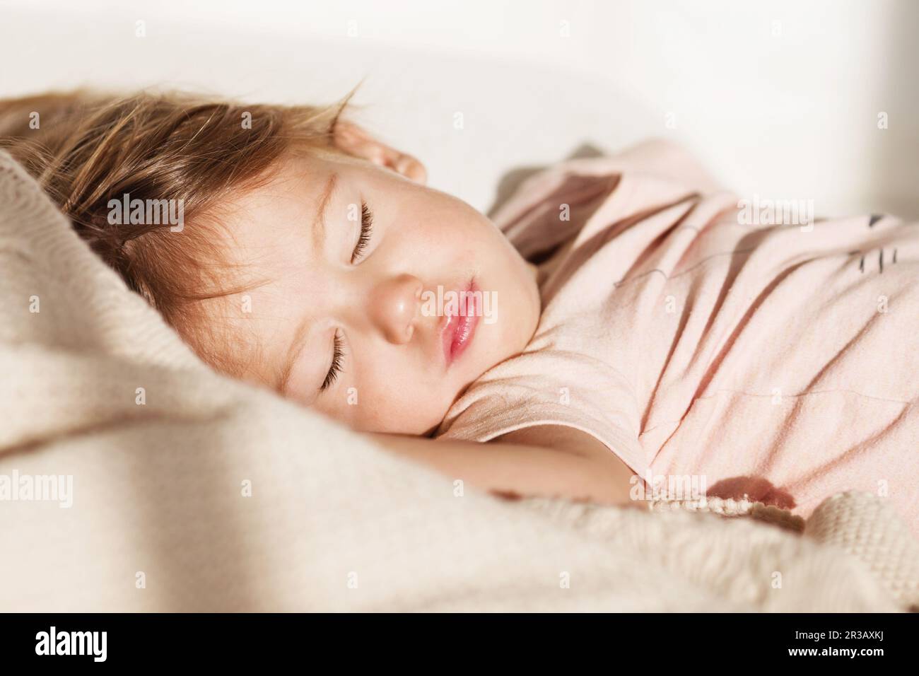 Sleeping little girl. Carefree sleep little baby with a soft toy on the