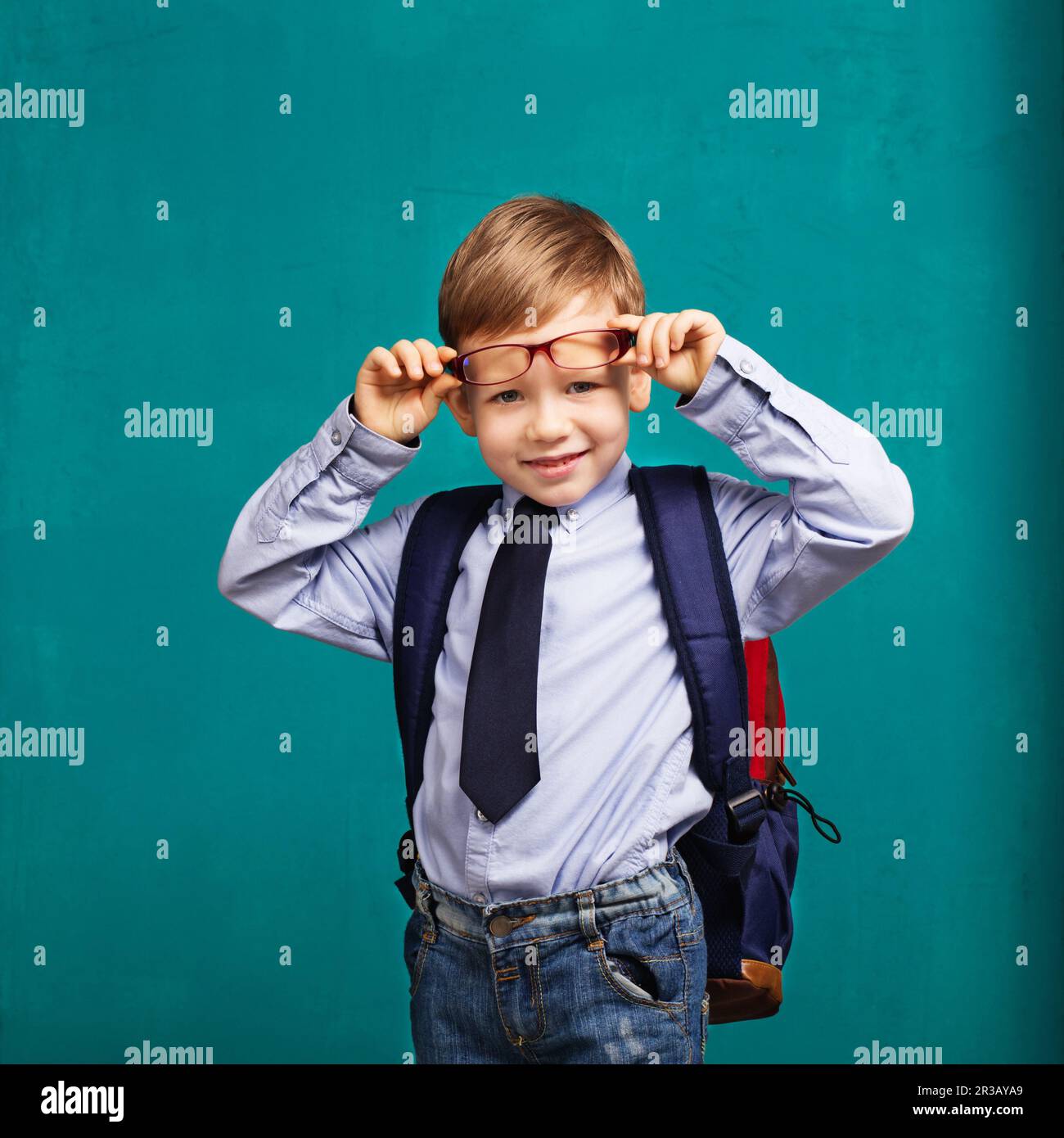 Little Boy in eyeglasses with big backpack. School, kid, rucksack