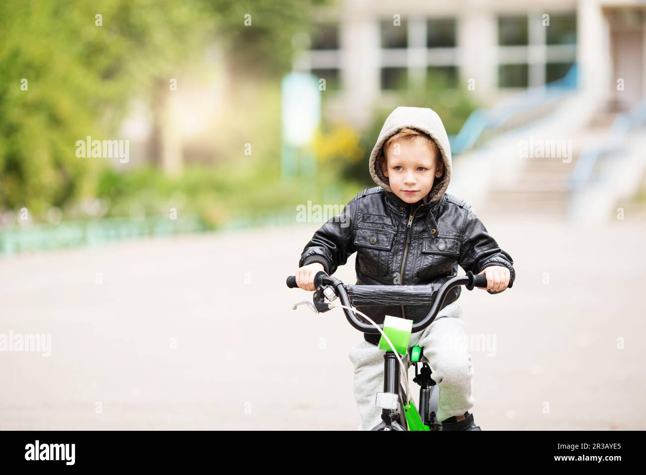 portrait of adorable little urban boy wearing black leather jacket ...