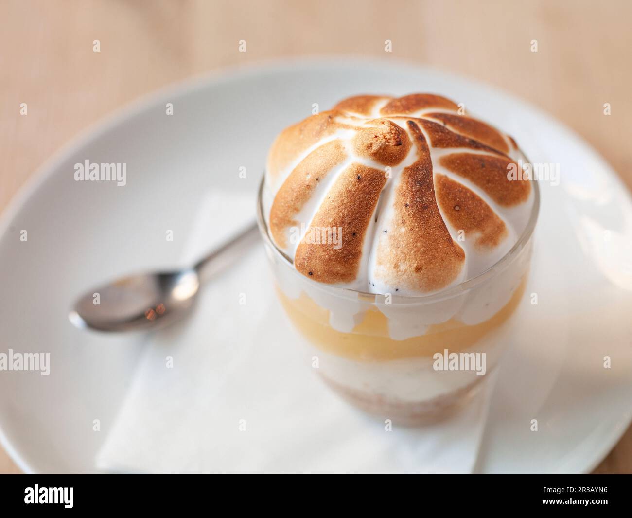 Layer dessert with lemon curd and meringue topping Stock Photo Alamy