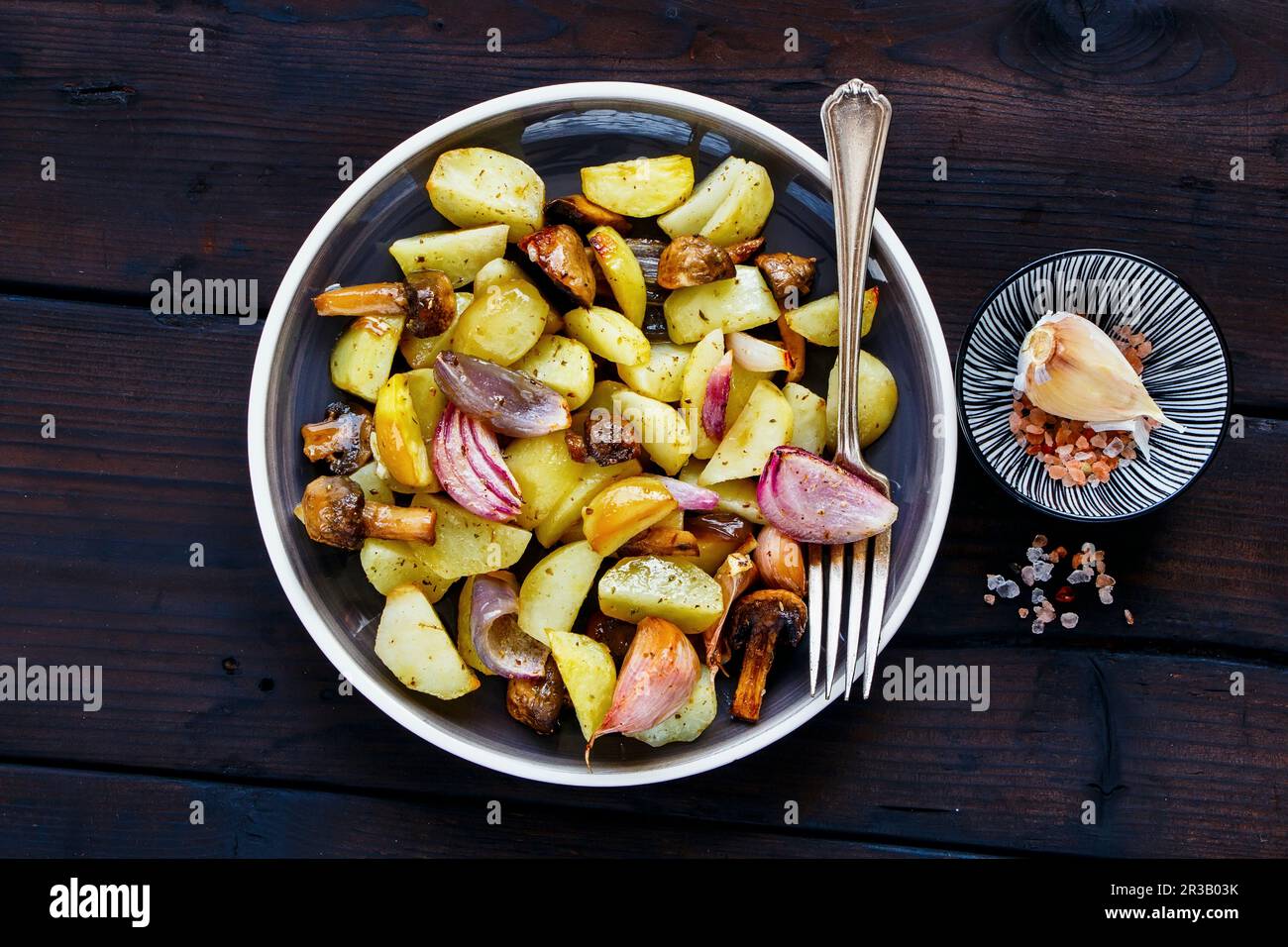 Roasted potato, mushroom and onion in plate Stock Photo Alamy