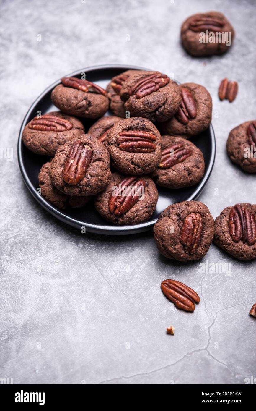 Vegan chocolate and pecan nut biscuits Stock Photo Alamy