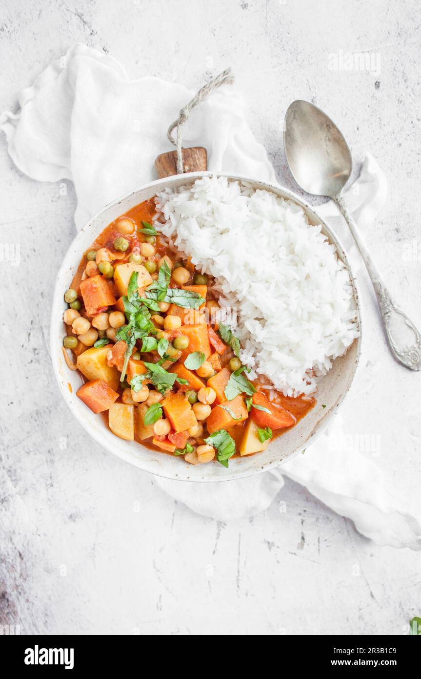 Thai vegan red curry made with chickpeas, sweet potato, carrot, green